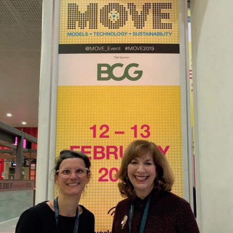 Jan Carpman and Marion Decaillet pose with a conference banner at the MOVE Conference in London
